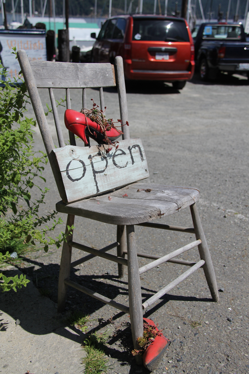 The shop’s open chair with red shoes, Cowichan Bay